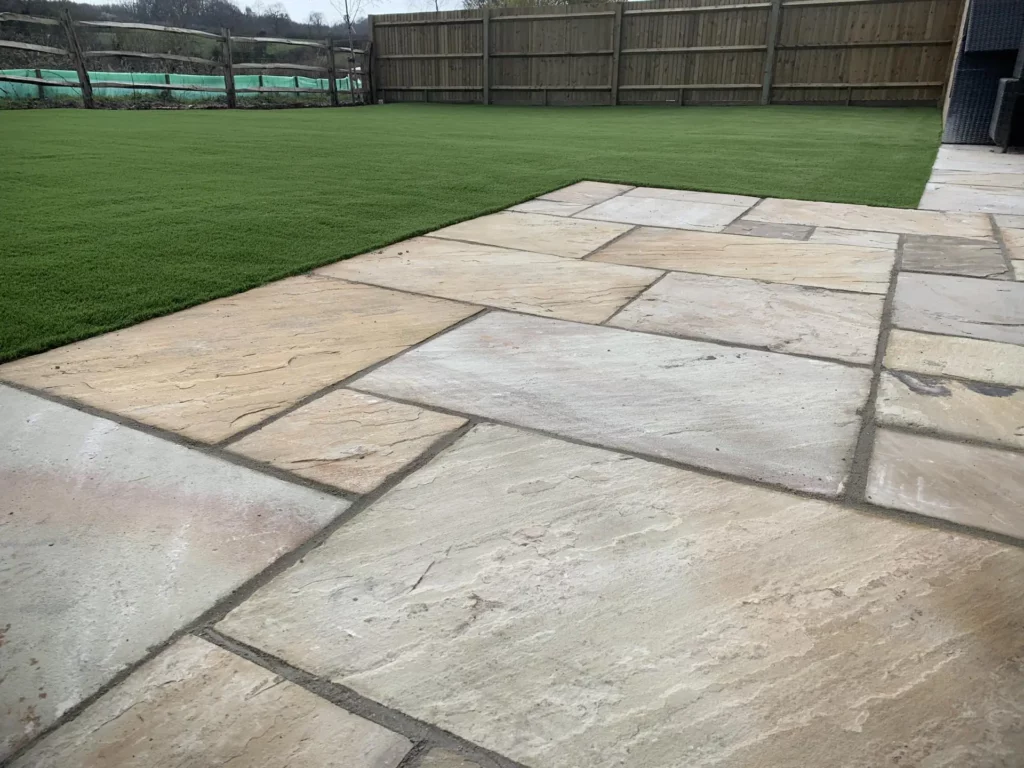 Fake grass with stone patio