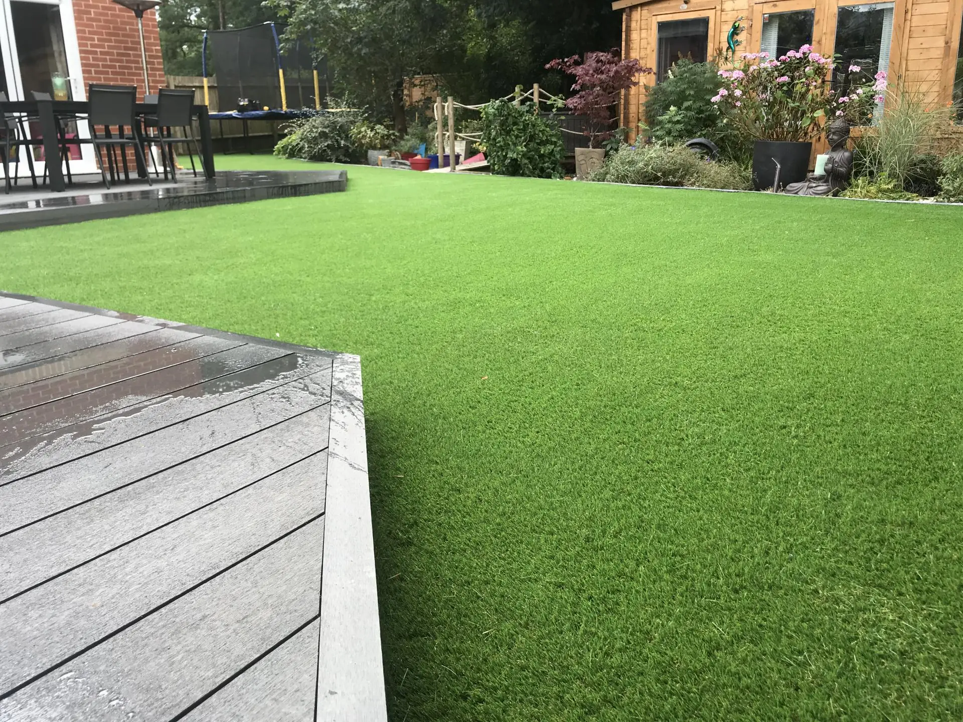 Fake grass with dark brown decking