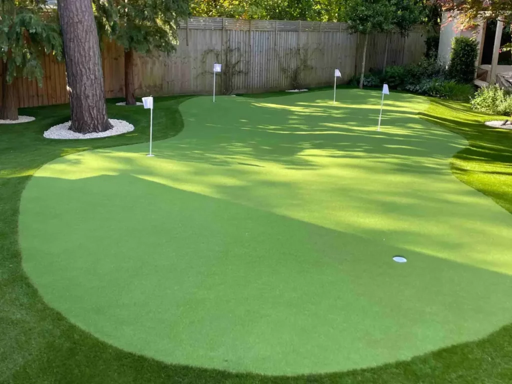 Custom artificial grass putting green installation by Look Real Lawns in residential garden